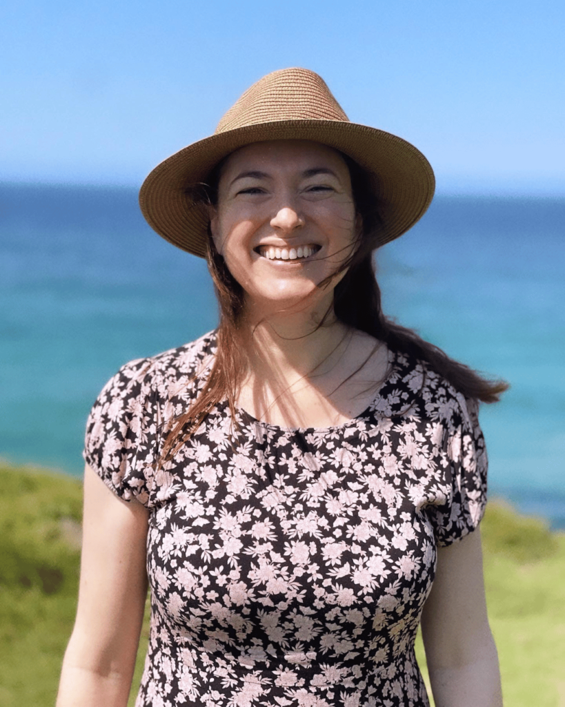 Emma Wertheim smiling with ocean vista in background